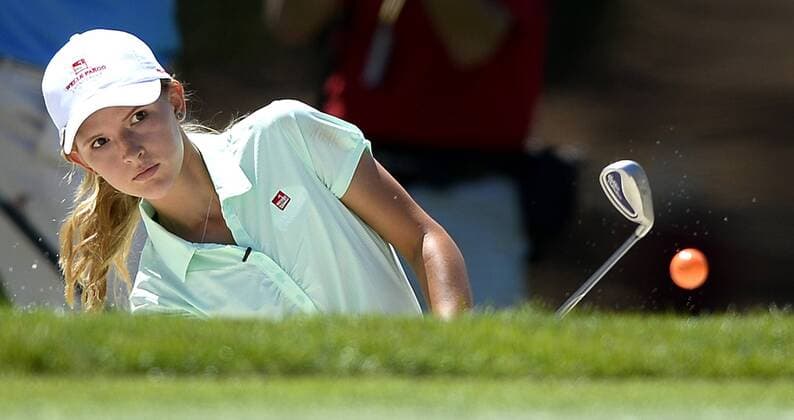 May 13, 2015 - Charlotte, NC, USA - Grace Vaughan chips her ball out of a sand bunker along the fifth green during the Pro-Am on Wednesday, May 13, 2015, at Quail Hollow Club in Charlotte, N.C. Vaughan, from Spartanburg, S.C., was the winner of an essay contest and was part of PGA Golf Herren player Rory McIlroy s team during the Pro-Am. Wells Fargo Pro-Am round - ZUMAm67_