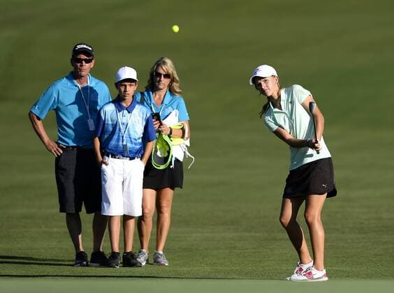 May 13, 2015 - Charlotte, NC, USA - Grace Vaughan chips her ball onto the 18th green during the Pro-Am on Wednesday, May 13, 2015, at Quail Hollow Club in Charlotte, N.C. Vaughan, from Spartanburg, S.C., was the winner of an essay contest that teamed her with Rory McIlroy during the Pro-Am. Wells Fargo Pro-Am round - ZUMAm67_