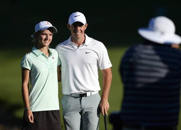 May 13, 2015 - Charlotte, NC, USA - Grace Vaughan, left, and Rory McIlroy pose for photographers following play in the Pro-Am on Wednesday, May 13, 2015, at Quail Hollow Club in Charlotte, N.C. Vaughan, from Spartanburg, S.C., was the winner of an essay contest that teamed her with McIlroy during the Pro-Am. Wells Fargo Pro-Am round - ZUMAm67_
