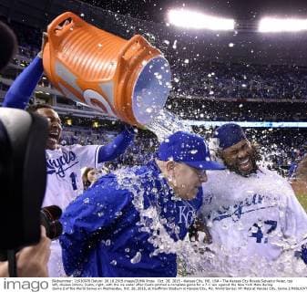 Oct. 28, 2015 - Kansas City, MO, USA - The Kansas City Royals Salvador Perez, top left, douses Johnny Cueto, right, with the ice water after Cueto pitched a complete game for a 7-1 win against the New York Mets during Game 2 of the World Series on Wednesday, Oct. 28, 2015, at Kauffman Stadium in Kansas City, Mo. World Series: NY Mets at Kansas City, Game 2 - ZUMAm67_