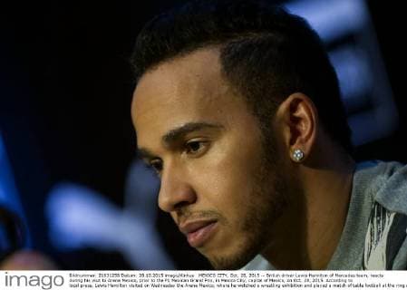 MEXICO CITY, Oct. 28, 2015 -- British driver Lewis Hamilton of Mercedes team, reacts during his visit to Arena Mexico, prior to the F1 Mexican Grand Prix, in Mexico City, capital of Mexico, on Oct. 28, 2015. According to local press, Lewis Hamilton visited on Wednesday the Arena Mexico, where he watched a wrestling exhibition and played a match of table football at the ring with Mexican soccer player Oribe Peralta. The F1 Mexican Grand Prix will be held from Oct. 30 to Nov. 1, in Mexico City. ) (SP)MEXICO-MEXICO CITY-AUTOMOBILE-F1 OSCARxRAMIREZ