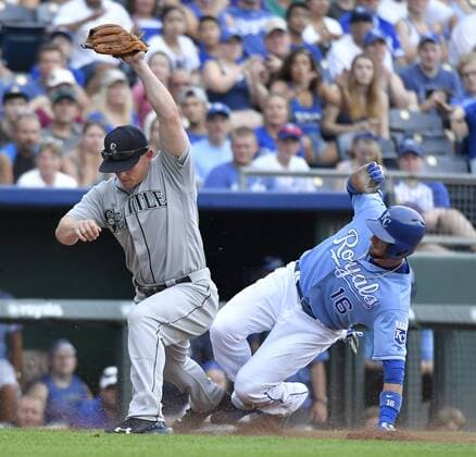 July 9, 2016 - Kansas City, MO, USA - The Kansas City Royals Paulo Orlando is forced out at third by Seattle Mariners third baseman Kyle Seager, left, on a bunt by Alcides Escobar in the sixth inning on Saturday, July 9, 2016, at Kauffman Stadium in Kansas City, Mo. The Royals won, 5-3. Seattle at Kansas City - ZUMAm67_