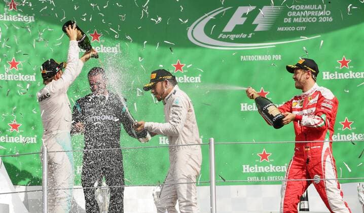 British driver Lewis Hamilton (3L), first qualified, German Nico Rosberg (L), second qualified, and German Sebastian Vettel, (R) third qualified, celebrate with Mercedes Benz coordinatior Tony Walton (2L) after Mexico s Formula One Grand Prix, held at Autodromo Hermanos Rodriguez, in Mexico City, Mexico, 30 October 2016. Mexico s Formula One Grand Prix !ACHTUNG: NUR REDAKTIONELLE NUTZUNG! MEX134 20161030-636134656282111941