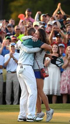 April 9, 2017 - Augusta, GA, USA - Sergio Garcia, left, meets his girlfriend Angela Akins, right, on the 18th green as he celebrates defeating Justin Rose in a one-hole playoff on the 18th green on Sunday, April 9, 2017 at Augusta National Golf Club in Augusta, Ga. Masters 2017 Round 4 - ZUMAm67_ 20170409_zaf_m67_219 Copyright: xJeffxSinerx