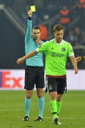GER, UEFA EL, FC Schalke 04 (GER) vs Ajax Amsterdam (NED) 20.04.2017, Veltins-Arena, Gelsenkirchen, GER, UEFA EL, FC Schalke 04 (GER) vs Ajax Amsterdam (NED), im Bild gelbe Karte für Joel Veltman ( Amsterdam 3 ), rechts durch Schiedsrichter Ovidiu Alin Hategan, links Foto © nordphoto Treese nordphotoxTreese