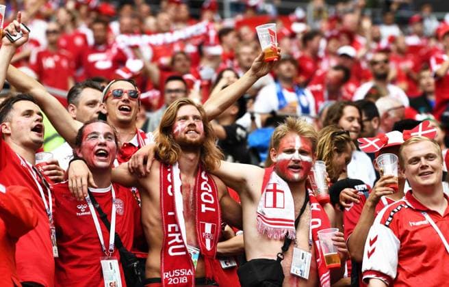 Danish fans wave flags and shout to show their support for Denmark in the Group C match against France during the 2018 FIFA World Cup WM Weltmeisterschaft Fussball in Moscow, Russia, 26 June 2018. For 37 games, the one certainty at this World Cup had been goals. Every game had produced at least one: a powerful header, a slick backheel, a well-shaped free kick. Mexican goals and Brazilian goals and lots and lots of Russian, Belgian and English goals. But through it all, the tournament had not produced a single scoreless tie ¡ª until Tuesday, when France and Denmark slogged through 90 torpid minutes at the Luzhniki Stadium here, and the streak ¡ª the longest without a 0-0 tie to start a World Cup in its history ¡ª was over. Not that the French, who had already clinched a spot in the round of 16, or the Danes for that matter, will complain. Their 0-0 draw, combined with Peru¡¯s 2-0 win over Australia, sent France through to the knockout round as the group winner, with Denmark as the runner-up. France and Denmark advance after World Cup s first 0-0 draw 20180627_82080