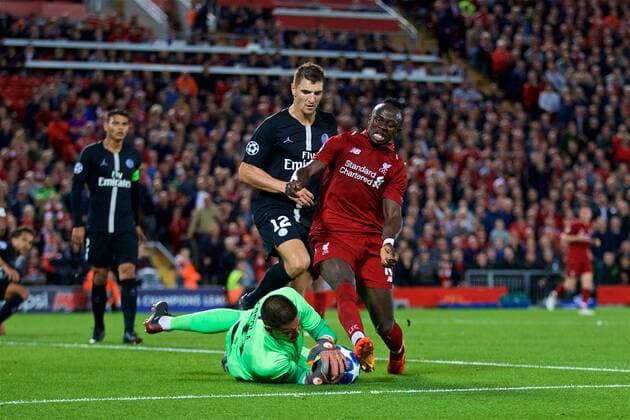 (180919) -- LIVERPOOL, Sept. 19, 2018 -- Liverpool s Sadio Mane (R), Paris Saint-Germain s goalkeeper Alphonse Areola (Bottom) and Thomas Meunier (2nd R) compete during the UEFA Champions League Group C match between Liverpool and Paris Saint-Germain at Anfield Stadium in Liverpool, Britain on Sept. 18, 2018. Liverpool won 3-2. FOR EDITORIAL USE ONLY. NOT FOR SALE FOR MARKETING OR ADVERTISING CAMPAIGNS. NO USE WITH UNAUTHORIZED AUDIO, VIDEO, DATA, FIXTURE LISTS, CLUB LEAGUE LOGOS OR LIVE SERVICES. ONLINE IN-MATCH USE LIMITED TO 45 IMAGES, NO VIDEO EMULATION. NO USE IN BETTING, GAMES OR SINGLE CLUB LEAGUE PLAYER PUBLICATIONS. (SP)BRITAIN-LIVERPOOL-FOOTBALL-UEFA CHAMPIONS LEAGUE-LIVERPOOL VS PSG HanxYan