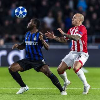 EINDHOVEN, Netherlands, 03-10-2018, football, Philips stadium, Champions league, season 2018 2019, Inter Milan player Kwadwo Asamoah (L), PSV player Angelino (R), during the match PSV - Inter Milan, PSV - Inter Milan x2517853x