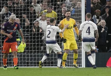(190410) -- LONDON, April 10, 2019 (Xinhua) -- Tottenham Hotspur s goalkeeper Hugo Lloris (2nd R) celebrates after saving a penalty by Manchester City s Sergio Aguero (1st L) during the UEFA Champions League Quater Final First Leg match between Tottenham Hotspur and Manchester City at The Tottenham Hotspur Stadium in London, Britain on April 9, 2019. Tottenham Hotspur won 1-0. (Xinhua Han Yan) FOR EDITORIAL USE ONLY. NOT FOR SALE FOR MARKETING OR ADVERTISING CAMPAIGNS. NO USE WITH UNAUTHORIZED AUDIO, VIDEO, DATA, FIXTURE LISTS, CLUB LEAGUE LOGOS OR LIVE SERVICES. ONLINE IN-MATCH USE LIMITED TO 45 IMAGES, NO VIDEO EMULATION. NO USE IN BETTING, GAMES OR SINGLE CLUB LEAGUE PLAYER PUBLICATIONS. (SP)BRITAIN-LONDON-FOOTBALL-CHAMPIONS LEAGUE-QUARTERFINAL-TOT HOTSPUR VS MAN CITY
