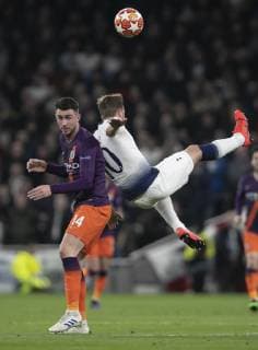 (190410) -- LONDON, April 10, 2019 (Xinhua) -- Tottenham Hotspur s Harry Kane (R) vies with Manchester City s Aymeric Laporte during the UEFA Champions League Quater Final First Leg match between Tottenham Hotspur and Manchester City at The Tottenham Hotspur Stadium in London, Britain on April 9, 2019. Tottenham Hotspur won 1-0. (Xinhua Han Yan) FOR EDITORIAL USE ONLY. NOT FOR SALE FOR MARKETING OR ADVERTISING CAMPAIGNS. NO USE WITH UNAUTHORIZED AUDIO, VIDEO, DATA, FIXTURE LISTS, CLUB LEAGUE LOGOS OR LIVE SERVICES. ONLINE IN-MATCH USE LIMITED TO 45 IMAGES, NO VIDEO EMULATION. NO USE IN BETTING, GAMES OR SINGLE CLUB LEAGUE PLAYER PUBLICATIONS. (SP)BRITAIN-LONDON-FOOTBALL-CHAMPIONS LEAGUE-QUARTERFINAL-TOT HOTSPUR VS MAN CITY