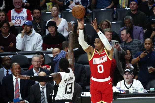 November 22, 2019, Los Angeles, California, U.S: Houston Rockets Russell Westbrook (0) shoots against Los Angeles Clippersâ€⠢ Paul George (13) during an NBA, Basketball Herren, USA basketball game between Los Angeles Clippers and Houston Rockets, FRIDAY, NOV. 22, 2019, in Los Angeles. NBA 2019: Clippers 122:119 Rockets - ZUMAc68_ 20191122_zaf_c68_259 Copyright: xRingoxChiux