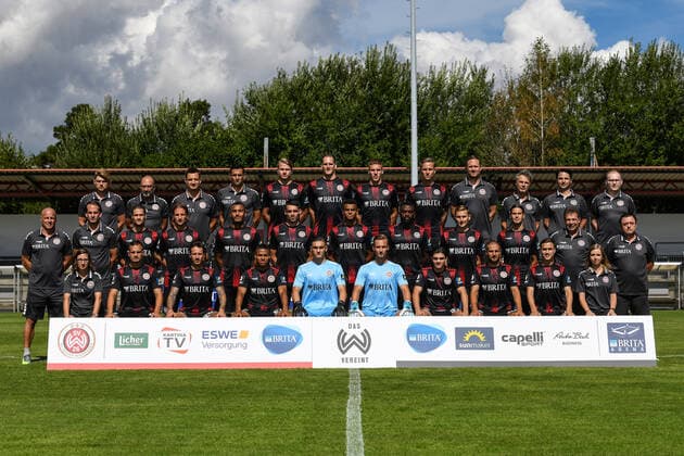 19 08 2020, xjhx, Soccer 3 Liga, SV Wehen Wiesbaden photo session season 2020 21 emspor, team photo Porträttermin 2020 2021, 3 rows from left Daniel Ebbert Head of Scouting Analysis , Dr Achim Bitschnau Team doctor , Dr Michael Hoestermann team doctor, Marjan Petkovic goalkeeper coach, Florian Carstens, Benedikt Röcker, Jakov Medic, Phillip Tietz, Sebastian Wagener athletics coach, Dr Tammo Quitzau team doctor hygiene officer, Jürgen core physiotherapist , Philipp Gründler Senior Scout Analyst 2 row from left Mike Krannich Co-Trainer , Rüdiger Rehm Head Coach , Johannes Wurtz, Stefan Aigner, Maurice Malone, Sascha Mockenhaupt, Marvin Ajani, Paterson Chato, Marc Lais, Tobias Schwede, Gerhard Eckel Supervisor , Torsten Conradi Supervisor 1 row from left Julia Wallraff Assistant to the Sports Director, Sebastian Mrowca, Moritz Kuhn, Michael Guthörl, Arthur Lyska, Tim Boss, Ben Bischof, Michel Niemeyer, Gianluca Korte, Shaline Deuchert Physiotherapist Wiesbaden