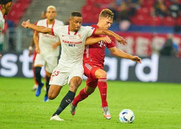Budapest, Hungary, 24th September 2020. Joshua KIMMICH, FCB 6 compete for the ball, tackling, duel, header, zweikampf, action, fight against FERNANDO, Sevilla 25 in the Final UEFA Supercup match FC BAYERN MUENCHEN - FC SEVILLA in Season 2019 2020, FCB, Munich,