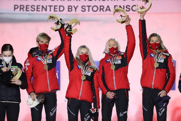 NORDIC SKIING - FIS Nordic World Ski Championships Oberstdorf 2021 OBERSTDORF,GERMANY,27.FEB.21 - NORDIC SKIING, Ski jumping, Skispringen, Ski, nordisch - FIS Nordic World Ski Championships, normal hill, ladies, team event, award ceremony. Image shows the team of AUT. Keywords: medal, trophy. GEPAxpictures xChristianxWalgram