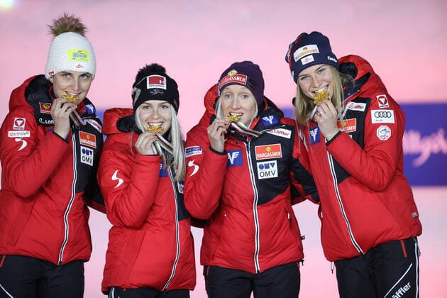 NORDIC SKIING - FIS Nordic World Ski Championships Oberstdorf 2021 OBERSTDORF,GERMANY,27.FEB.21 - NORDIC SKIING, Ski jumping, Skispringen, Ski, nordisch - FIS Nordic World Ski Championships, normal hill, ladies, team event, award ceremony. Image shows the team of AUT. Keywords: medal, trophy. GEPAxpictures xChristianxWalgram