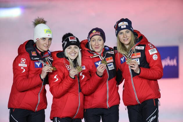 NORDIC SKIING - FIS Nordic World Ski Championships Oberstdorf 2021 OBERSTDORF,GERMANY,27.FEB.21 - NORDIC SKIING, Ski jumping, Skispringen, Ski, nordisch - FIS Nordic World Ski Championships, normal hill, ladies, team event, award ceremony. Image shows the team of AUT. Keywords: medal, trophy. GEPAxpictures xChristianxWalgram