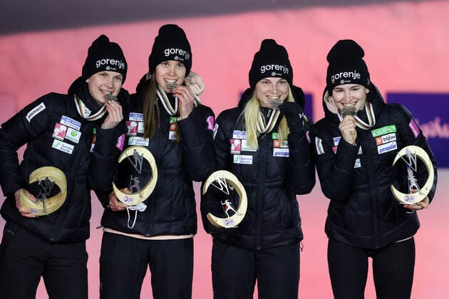 NORDIC SKIING - FIS Nordic World Ski Championships Oberstdorf 2021 OBERSTDORF,GERMANY,27.FEB.21 - NORDIC SKIING, Ski jumping, Skispringen, Ski, nordisch - FIS Nordic World Ski Championships, normal hill, ladies, team event, award ceremony. Image shows Ema Klinec, Ursa Bogataj, Spela Rogelj and Nika Kriznar (SLO). Keywords: medal. GEPAxpictures xChristianxWalgram