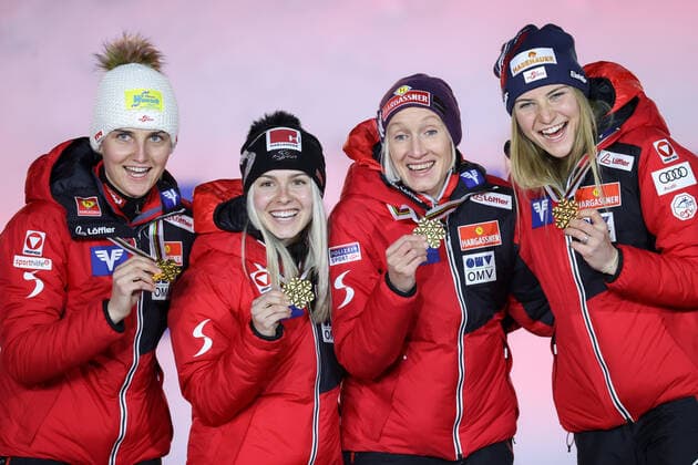 NORDIC SKIING - FIS Nordic World Ski Championships Oberstdorf 2021 OBERSTDORF,GERMANY,27.FEB.21 - NORDIC SKIING, Ski jumping, Skispringen, Ski, nordisch - FIS Nordic World Ski Championships, normal hill, ladies, team event, award ceremony. Image shows Sophie Sorschag, Chiara Hoelzl, Daniela Iraschko-Stolz and Marita Kramer (AUT). Keywords: medal. GEPAxpictures xChristianxWalgram