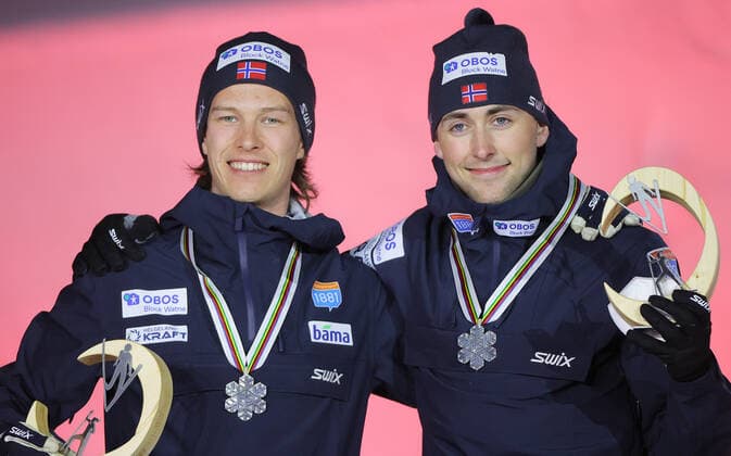 NORDIC SKIING - FIS Nordic World Ski Championships Oberstdorf 2021 OBERSTDORF,GERMANY,06.MAR.21 - NORDIC SKIING, NORDIC COMBINED, Ski jumping, Skispringen, Ski, nordisch - FIS Nordic World Ski Championships, team sprint, large hill, men, award ceremony. Image shows the rejoicing of Espen Andersen and Jarl Magnus Riiber (NOR). GEPAxpictures xThomasxBachun