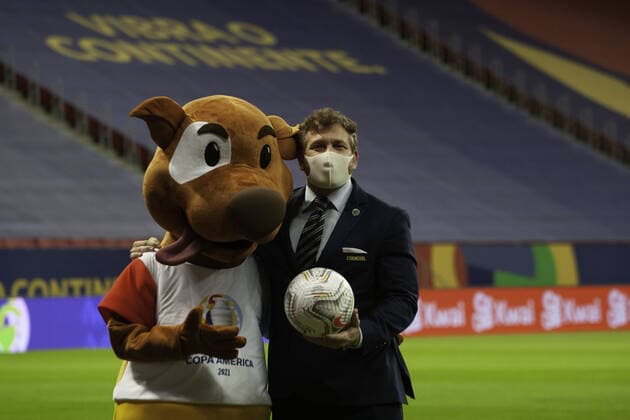 June 18, 06, 2021, Brasilia, Federal District, Brazil: President of Conmebol, Alejandro Dominguez, poses with mascot Pibe moments before soccer match between teams of Argentina and Uruguay, valid for second round of Group A of Copa America, held at Mane Garrincha stadium, in Brasilia, on Friday (18). Copyright: xLecoxVianax