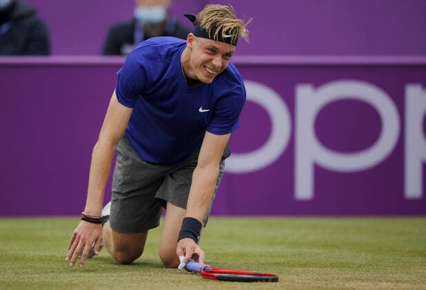 Mandatory Credit: Photo by Ella Ling BPI Shutterstock (12115521bj) Denis Shapovalov of Canada smiles as he slips over Cinch Championships, Day Six, Tennis, Queens Club, London, UK - 19 June 2021 EDITORIAL USE ONLY No use with unauthorised audio, video, data, fixture lists, club league logos or live services. Online in-match use limited to 120 images, no video emulation. No use in betting, games or single club league player publications. Cinch Championships, Day Six, Tennis, Queens Club, London, UK - 19 June 2021 EDITORIAL USE ONLY No use with unauthorised audio, video, data, fixture lists, club league logos or live services. Online in-match use limited to 120 images, no video emulation. No use in betting, games or single club league player publications. Copyright: xEllaxLing BPI Shutterstockx 12115521bj