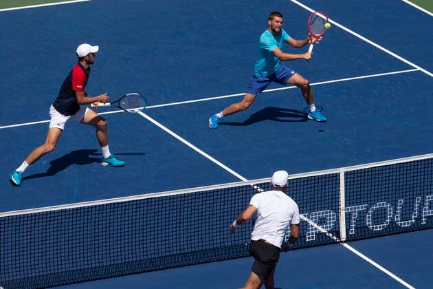 August 14, 2021, Toronto, on, Canada: Croatia s Nikola Mektic, right, and Mate Pavic return during their 7-6 7-6 win against Kevin Krawietz, of Germany, and Horia Tecau, of Romania, in National Bank Open men s tennis action in Toronto, Saturday, Aug. 14, 2021 Niikola Mektic; Mate Pavic.. - ZUMAc35_ 20210814_zaf_c35_015 Copyright: xChrisxYoungx