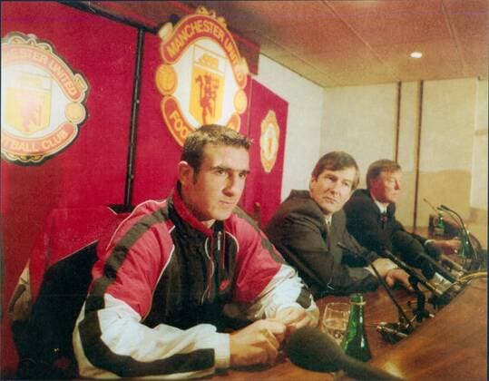 Mandatory Credit: Photo by Jim Hutchison ANL Shutterstock (1458567a) Eric Cantona Signs For Manchester United, ManU Watched By Chairman Martin Edwards And Manager Alex Ferguson Eric Cantona Signs For Manchester United Watched By Chairman Martin Edwards And Manager Alex Ferguson EDITORIAL USE ONLY No use with unauthorised audio, video, data, fixture lists (outside the EU), club league logos or live services. Online in-match use limited to 45 images (+15 in extra time). No use to emulate moving images. No use in betting, games or single club league player publications services. Eric Cantona Signs For Manchester United Watched By Chairman Martin Edwards And Manager Alex Ferguson EDITORIAL USE ONLY No use with unauthorised audio, video, data, fixture lists (outside the EU), club league logos or live services. Online in-match use limited to 45 images (+15 in extra time). No use to emulate moving images. No use in betting, games or Copyright: xJimxHutchison ANL Shutterstockx 1458567a