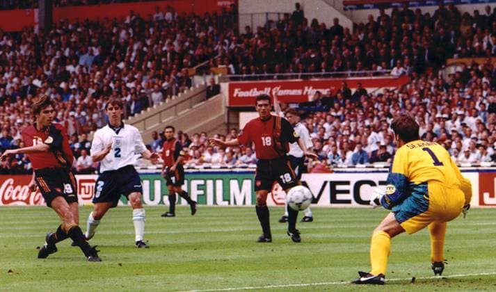 Mandatory Credit: Photo by Ted Blackbrow ANL Shutterstock (1338631a) Football Interntional European Championship, EM, Europameisterschaft 1996 Quarter Final Match England V Spain (england Win 4-2 On Penalties) Cisco Kiko Shoots Past David Seaman But Goal Dissallowed Football Interntional European Championship 1996 Quarter Final Match England V Spain (england Win 4-2 On Penalties) Cisco Kiko Shoots Past David Seaman But Goal Dissallowed EDITORIAL USE ONLY No use with unauthorised audio, video, data, fixture lists (outside the EU), club league logos or live services. Online in-match use limited to 45 images (+15 in extra time). No use to emulate moving images. No use in betting, games or single club league player publications services. Football Interntional European Championship 1996 Quarter Final Match England V Spain (england Win 4-2 On Penalties) Cisco Kiko Shoots Past David Seaman But Goal Dissallowed EDITORIAL USE ONLY No use with unauthorised audio, video, data, fixture lists (outside the EU), club league logos or live services. Online in-match use limited to 45 images (+15 in extra time). No use to emulate moving images. No use in betting, games or Copyright: xTedxBlackbrow ANL Shutterstockx 1338631a