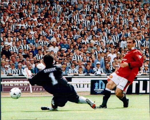 Mandatory Credit: Photo by Andy Hooper ANL Shutterstock (1334822a) Football 1996 97: Charity Shield - Manchester United, ManU 4 V Newcastle 0. Man Utd s Eric Cantona Scores Past Keeper Pavel Srnicek. Football 1996 97: Charity Shield - Manchester United 4 V Newcastle 0. Man Utd s Eric Cantona Scores Past Keeper Pavel Srnicek. EDITORIAL USE ONLY No use with unauthorised audio, video, data, fixture lists (outside the EU), club league logos or live services. Online in-match use limited to 45 images (+15 in extra time). No use to emulate moving images. No use in betting, games or single club league player publications services. Football 1996 97: Charity Shield - Manchester United 4 V Newcastle 0. Man Utd s Eric Cantona Scores Past Keeper Pavel Srnicek. EDITORIAL USE ONLY No use with unauthorised audio, video, data, fixture lists (outside the EU), club league logos or live services. Online in-match use limited to 45 images (+15 in extra time). No use to emulate moving images. No use in betting, games or Copyright: xAndyxHooper ANL Shutterstockx 1334822a