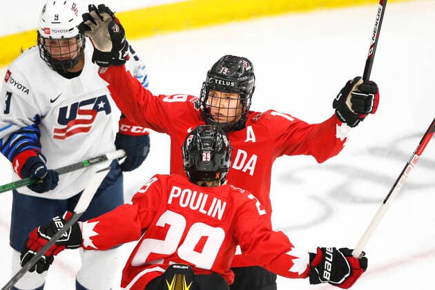 Canada player Brianne Jenner, top, celebrates with Marie-Philip Poulin, bott, her second period goal against the USA during IIHF Women s World Championship, WM, Weltmeisterschaft gold medal play in Calgary, Alberta, Canada on Aug. 31, 2021. digital photo by Larry MacDougal Brianne Jenner, Marie-Philip Poulin
