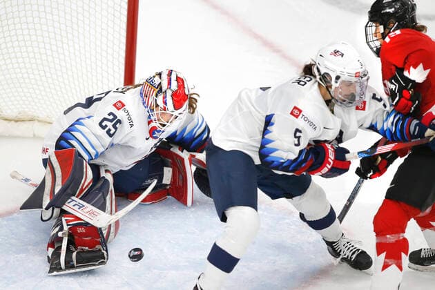 USA goalie Nicole Hensley, lt, makes a save against Canada player Brianne Jenner, rt, during IIHF Women s World Championship, WM, Weltmeisterschaft gold medal play in Calgary, Alberta, Canada on Aug. 31, 2021. Centre is USA player Megan Keller. digital photo by Larry MacDougal Nicole Hensley, Megan Keller., Brianne Jenner
