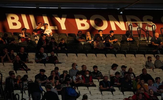 Mandatory Credit: Photo by Jed Leicester Shutterstock (12345727d) West Ham United fans in the evening sunlight in the Billy Bonds stand West Ham United v Leicester City, Premier League, Football, The London Stadium, London, UK - 23 Aug 2021 EDITORIAL USE ONLY No use with unauthorised audio, video, data, fixture lists, club league logos or live services. Online in-match use limited to 120 images, no video emulation. No use in betting, games or single club league player publications. West Ham United v Leicester City, Premier League, Football, The London Stadium, London, UK - 23 Aug 2021 EDITORIAL USE ONLY No use with unauthorised audio, video, data, fixture lists, club league logos or live services. Online in-match use limited to 120 images, no video emulation. No use in betting, games or single club league player publications. Copyright: xJedxLeicester Shutterstockx 12345727d