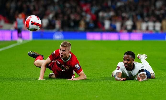 Mandatory Credit: Photo by Javier Garcia Shutterstock (12534018t) Andras Schafer of Hungary fouls Raheem Sterling of England England v Hungary, FIFA World Cup, WM, Weltmeisterschaft, Fussball 2022 Qualifying, Group I, Football, Wembley Stadium, London, UK - 12 Oct 2021 EDITORIAL USE ONLY No use with unauthorised audio, video, data, fixture lists, club league logos or live services. Online in-match use limited to 120 images, no video emulation. No use in betting, games or single club league player publications. England v Hungary, FIFA World Cup 2022 Qualifying, Group I, Football, Wembley Stadium, London, UK - 12 Oct 2021 EDITORIAL USE ONLY No use with unauthorised audio, video, data, fixture lists, club league logos or live services. Online in-match use limited to 120 images, no video emulation. No use in betting, games or single club league player publications. Copyright: xJavierxGarcia Shutterstockx 12534018t