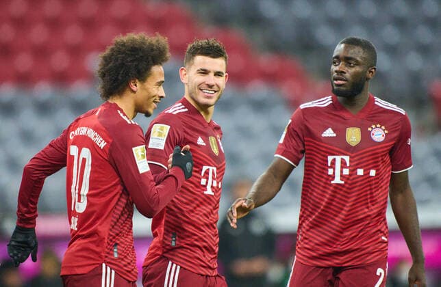 Leroy SANE, FCB 10 celebrates his goal, happy, laugh, celebration, 3-0 with Lucas HERNANDEZ (FCB 21) Dayot Upamecano , FCB 2 in the match FC BAYERN MÜNCHEN - VFL WOLFSBURG 4-0 1.German Football League on Dec 17, 2021 in Munich, Germany. Season 2021 2022, matchday 17, 1.Bundesliga, FCB, München, 17.Spieltag. FCB
