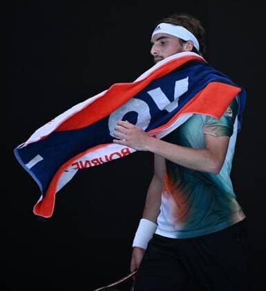 Mandatory Credit: Photo by James Gourley Shutterstock (12765058ef) Stefanos Tsitsipas with a towel during his second round match Australian Open, Day Four, Tennis, Melbourne Park, Melbourne, Australia - 20 Jan 2022 Australian Open, Day Four, Tennis, Melbourne Park, Melbourne, Australia - 20 Jan 2022 Copyright: xJamesxGourley Shutterstockx 12765058ef