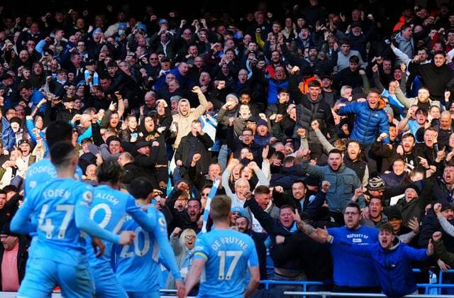 Mandatory Credit: Photo by Javier Garcia Shutterstock (12833303cm) Kevin De Bruyne of Manchester City celebrates scoring the opening goal with fans Manchester City v Manchester United, ManU Premier League, Football, Etihad Stadium, Manchester, UK - 06 Mar 2022 EDITORIAL USE ONLY No use with unauthorised audio, video, data, fixture lists, club league logos or live services. Online in-match use limited to 120 images, no video emulation. No use in betting, games or single club league player publications. Manchester City v Manchester United, Premier League, Football, Etihad Stadium, Manchester, UK - 06 Mar 2022 EDITORIAL USE ONLY No use with unauthorised audio, video, data, fixture lists, club league logos or live services. Online in-match use limited to 120 images, no video emulation. No use in betting, games or single club league player publications. Copyright: xJavierxGarcia Shutterstockx 12833303cm