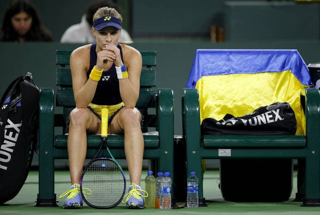 Mandatory Credit: Photo by Ella Ling Shutterstock (12841086dp) Dayana Yastremska of Ukraine sits next to the flag on the seat next to her BNP Paribas Open, Tennis, Day 1, Indian Wells Tennis Garden, California, USA - 09 Mar 2022 BNP Paribas Open, Tennis, Day 1, Indian Wells Tennis Garden, California, USA - 09 Mar 2022 Copyright: xEllaxLing Shutterstockx 12841086dp