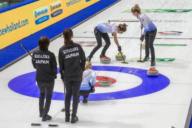 March 20, 2022, Prince George, BC, CANADA: United States skip Cory Christensen, kneeling, directs second Vicky Persinger, left, and lead Taylor Anderson as Japan third Seina Nakajima and skip Ikue Kitazawa look on at CN Centre on Sunday evening during at the Women s World Curling in Prince George, B.C., Sunday, March 20, 2022. Canada News - March 20, 2022 - ZUMAc35_ 20220320_zaf_c35_123 Copyright: xJamesxDoylex
