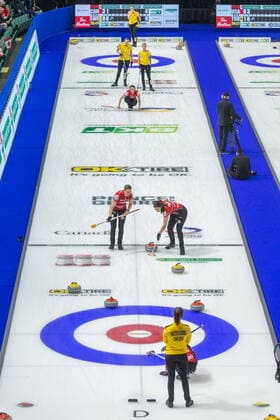 March 23, 2022, Prince George, BC, Canada: Sweden skip Anna Hasselborg and Canada skip Kerri Einarson look on as Team Canada lead Briane Meilleur, middle left, and Shannon Birchard sweep in front of a stone with third Val Sweeting watching her throw as Sweden second Agnes Knochenhaur, back left, and Sofia Mabergs looking on in front of third Sara McManus at the Women s World Curling Championship in Prince George, B.C., on Wednesday, March 23, 2022. Canada News - March 23, 2022 - ZUMAc35_ 20220323_zaf_c35_099 Copyright: xJamesxDoylex