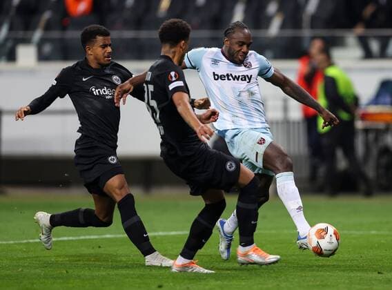 Mandatory Credit: Photo by Simon Dael Shutterstock (12925375dr) Michail Antonio of West Ham United has a shot at goal with Ansgar Knauff of Eintracht Frankfurt (l) and Tuta of Eintracht Frankfurt Eintracht Frankfurt v West Ham United, UEFA Europa League, Semi Final, Second Leg, Football, Deutsche Bank Park, Frankfurt, Germany - 05 May 2022 EDITORIAL USE ONLY No use with unauthorised audio, video, data, fixture lists, club league logos or live services. Online in-match use limited to 120 images, no video emulation. No use in betting, games or single club league player publications. Eintracht Frankfurt v West Ham United, UEFA Europa League, Semi Final, Second Leg, Football, Deutsche Bank Park, Frankfurt, Germany - 05 May 2022 EDITORIAL USE ONLY No use with unauthorised audio, video, data, fixture lists, club league logos or live services. Online in-match use limited to 120 images, no video emulation. No use in betting, games or single club league player publications. Copyright: xSimonxDael Shutterstockx 12925375dr
