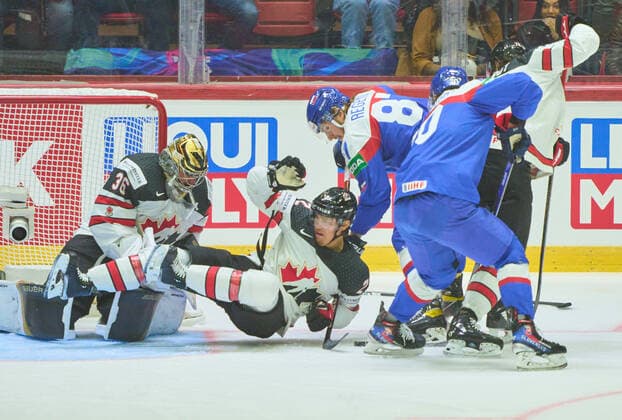 Zach Whitecloud Nr. 2 of Canada Logan Thompson Nr. 36 of Canada compete, fight for the puck against, Pavol Regenda, SVK 87 in the match SLOVAKIA - CANADA of the IIHF Ice hockey, Eishockey World Championship, WM, Weltmeisterschaft Group B in Helsinki, Finland, May 16, 2022, Season 2021 2022