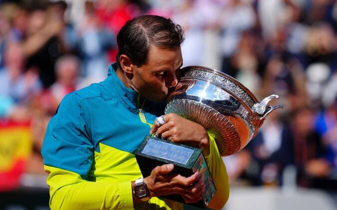Mandatory Credit: Photo by Javier Garcia Shutterstock (12960016bp) Rafael Nadal celebrates with the Coupe de Mousquetaires, the mens trophy, after winning his 14th Roland Garros French Open Tennis, Day 15, Roland Garros, Paris, France - 05 Jun 2022 French Open Tennis, Day 15, Roland Garros, Paris, France - 05 Jun 2022 Copyright: xJavierxGarcia Shutterstockx 12960016bp