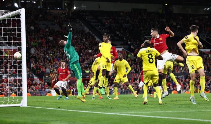 Manchester, England, 27th October 2022. Diogo Dalot of Manchester United, ManU heads the first goal during the UEFA Europa League match at Old Trafford, Manchester. Picture credit should read: Darren Staples Sportimage EDITORIAL USE ONLY. No use with unauthorised audio, video, data, fixture lists, club league logos or live services. Online in-match use limited to 120 images, no video emulation. No use in betting, games or single club league player publications. SPI-1993-0023