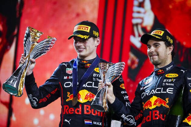 VERSTAPPEN Max (ned), Red Bull Racing RB18, PEREZ Sergio (mex), Red Bull Racing RB18, portrait on the podium during the Formula 1 Etihad Airways Abu Dhabi Grand Prix 2022, 22nd round of the 2022 FIA Formula One World Championship, WM, Weltmeisterschaft from November 18 to 20, 2022 on the Yas Marina Circuit, in Yas Island, Abu Dhabi - F1 - ABU DHABI GRAND PRIX 2022 - RACE DPPI Panoramic 00122050__V2_7614.JPG