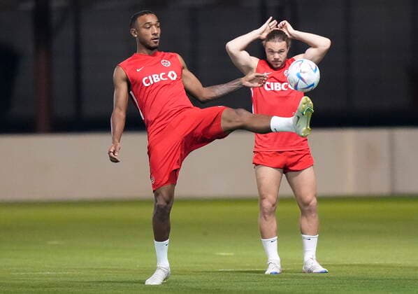 November 25, 2022, DOHA, QATAR: Canada defender Derek Cornelius, left, kicks the ball next to teammate Samuel Piette during practice at the World Cup in Doha, Qatar, Friday, Nov. 25, 2022. Canada News - November 25, 2022 - ZUMAc35_ 20221125_zaf_c35_041 Copyright: xNathanxDenettex