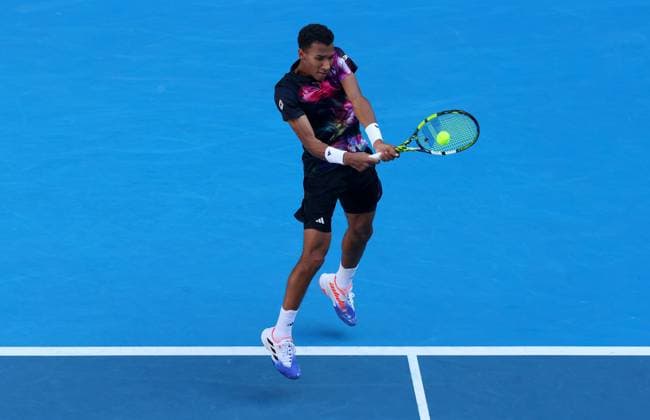 Mandatory Credit: Photo by Ella Ling Shutterstock (13716910ai) Felix Auger Aliassime of Canada in action Australian Open, Day Five, Tennis, Melbourne Park, Melbourne, Australia - 20 Jan 2023 Australian Open, Day Five, Tennis, Melbourne Park, Melbourne, Australia - 20 Jan 2023 Copyright: xEllaxLing Shutterstockx 13716910ai