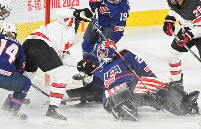 February 22, 2023, Laval, PQ, Canada: Ella Shelton of Canada scores against goaltender Nicole Hensley of the USA during first period Rivalry Series hockey action in Laval, Que., Wednesday, February 22, 2023. Nicole Hensley, Ella Shelton, - ZUMAc35_ 20230222_zaf_c35_161 Copyright: xGrahamxHughesx