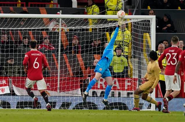 Manchester, England, 23rd February 2023. David De Gea of Manchester United, ManU produces a top class ave from Jules Kounde of Barcelona during the UEFA Europa League match at Old Trafford, Manchester. Picture credit should read: Andrew Yates Sportimage EDITORIAL USE ONLY. No use with unauthorised audio, video, data, fixture lists, club league logos or live services. Online in-match use limited to 120 images, no video emulation. No use in betting, games or single club league player publications. SPI-2256-0086