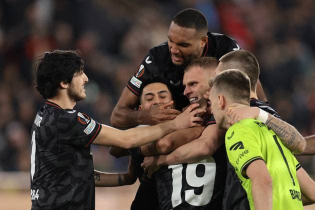Monaco, Monaco, 23rd February 2023. Moussa Diaby of Bayer Leverkusen is mobbed by team mates Sardar Azmoun, Mitchel Bakker, Nadiem Amiri, Jonathan Tah and Lukas Hradecky after scoring the winning penalty in the shoot out of the UEFA Europa League match at Stade Louis II, Monaco. Picture credit should read: Jonathan Moscrop Sportimage EDITORIAL USE ONLY. No use with unauthorised audio, video, data, fixture lists, club league logos or live services. Online in-match use limited to 120 images, no video emulation. No use in betting, games or single club league player publications. SPI-2233-0052