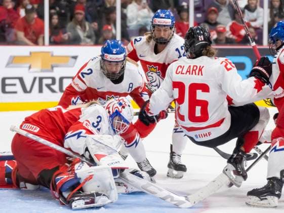 April 7, 2023, BRAMPTON, ON, CANADA: Canada forward Emily Clark (26) is flipped up as Czechia goaltender Blanka Skodova (31), defender Aneta Tejralova (2) and forward Klara Hymlarova (12) try to cover the puck during third period IIHF WomenöÄÃ s World Hockey Championship hockey action in Brampton, Ont., on Friday, April 7, 2023. Canada News - April 7, 2023 - ZUMAc35_ 20230407_zaf_c35_117 Copyright: xFrankxGunnx